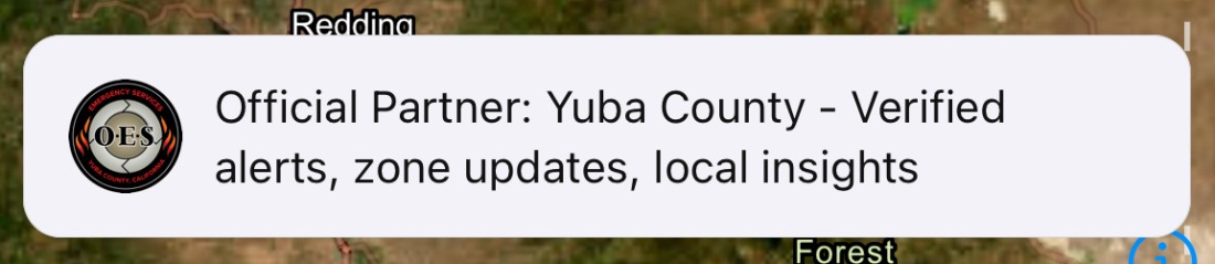 A banner at the top of the Sentinel map reading: Official Partner: Yuba County - Verified alerts, zone updates, local insights